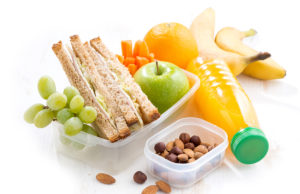 Lunchbox Tips to Maximize Your After School/Work ALTA Tennis Play school lunch with sandwich on white table, close-up