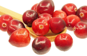 Cranberry, Spinach and Turkey Wrap cranberries and a wooden spoon