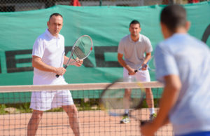 League News: Play Better Doubles Without Hitting A Ball Men playing tennis doubles