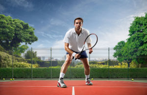 Time Your Split Step And Own The Net Young man is playing tennis on sunny day