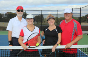 League News: A League Like No Other ALTA senior mixed doubles teams pose in front of net.