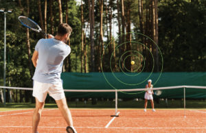 ‘I Don’t See The Ball Like I Used To. Help!’ Man and woman playing tennis on a red clay court.