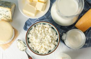 Building Stronger Bones For Better Tennis Different dairy products on white background, top view