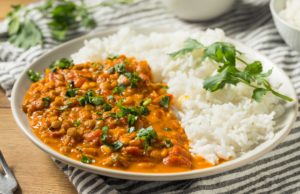 Explore Healthy Flavors Homemade Spicy Indian Curry Lentils with Rice and Cilantro