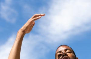 Beat The Summertime Cramps Man blocking the sun from his eyes