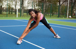 Do The Tennis 10+ Warmup/Cool Down young woman stretching