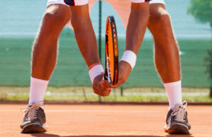 How To Handle Net Rushers In Doubles tennis player waiting tennis ball