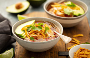 Chicken Tortilla Soup for those who don’t cook Slow cooker chicken taco soup topped with fresh cilantro and avocado