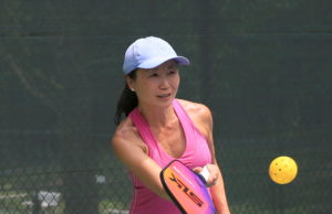 ALTA Pickleball: State of the League Female pickleball player on outdoor court