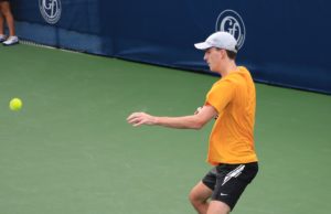 Returning Strategy In Doubles ALTA Mixed Doubles player returning a serve.