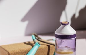 Should You Be Applying The Same Sport Science Concepts Used By The Pros? Water bottle next to a jump rope and yoga brick