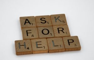 Good Question Sept/Oct 2023 Scrabble tiles spelling out the question "Ask for help."