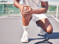 Unlock Your Full Potential Tennis, hands and knee in sports injury, accident or bruise holding painful area for medical emergency on the court. Hand of tennis player suffering from sore leg, fall or joint inflammation outside.