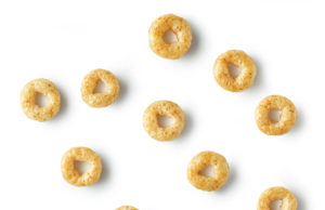 Cheerio Cookies sweet breakfast cereal rings macro isolated on white background, top view