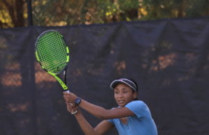 Why Is My Team at This Level? ALTA Sunday Women's League player hitting a backhand shot.
