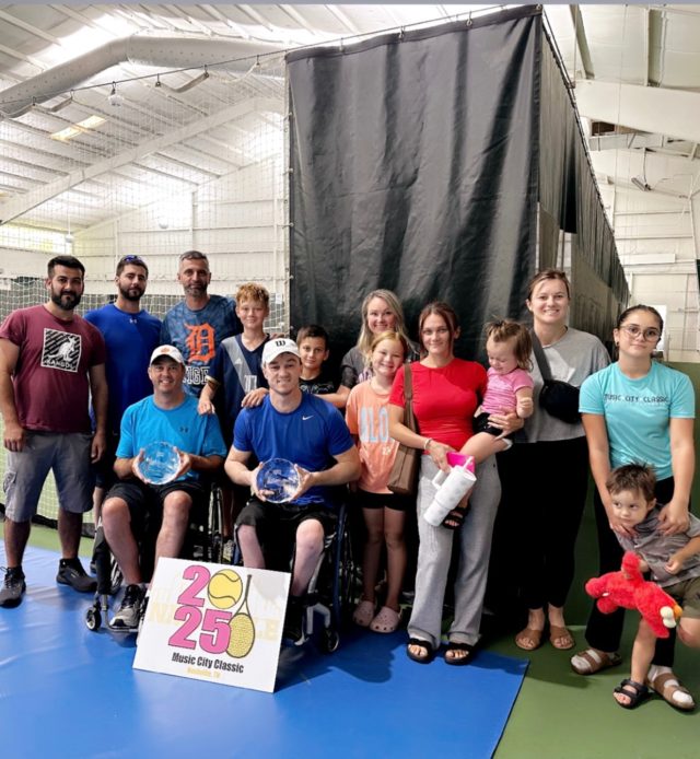 Samir Jusupovic and Rob Popelka with Samir's family.