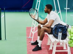 Secure A Win For Your Team Side view portrait of professional tennis player holding racket while taking break on bench in court, copy space