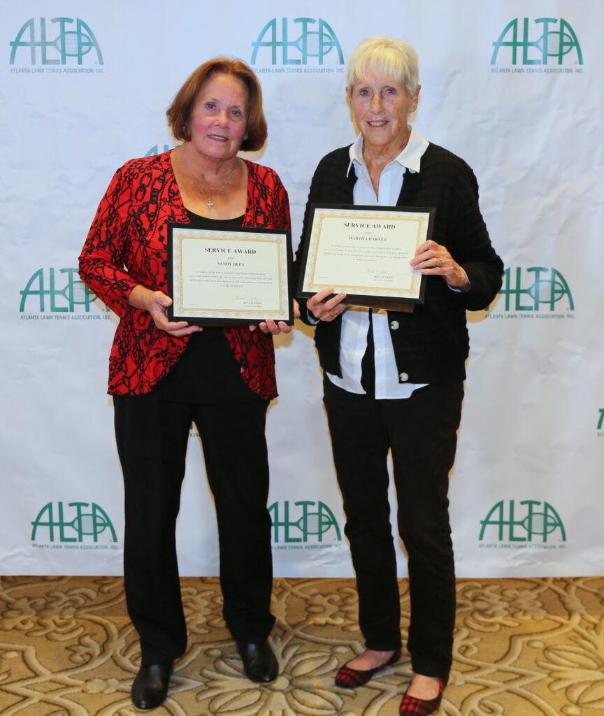 25-year service award winners Sandy Depa and Martha Harvey.