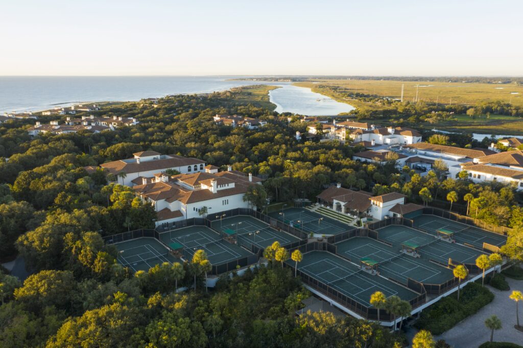A breathtaking aerial shot of Sea Island showcasing the unparalleled beauty, nestled between the Atlantic Ocean and marshland.
