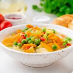 Vegetable soup, bright spring vegetarian dish.