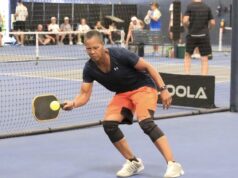 In A Pickle? The Big Swing Pickleball player hitting the ball.