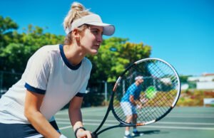 The Fastest Path To Real Improvement Mixed doubles team waiting to receive a serve.