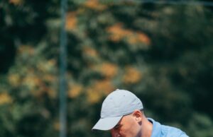 A Wonderful Tennis Experience Tennis instructor with young boy in tennis training lesson