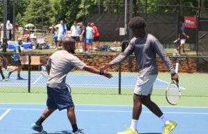 League News: The Sixth Line ALTA men's league doubles team celebrating a point.