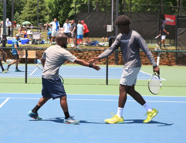 ALTA men's league doubles team celebrating a point.