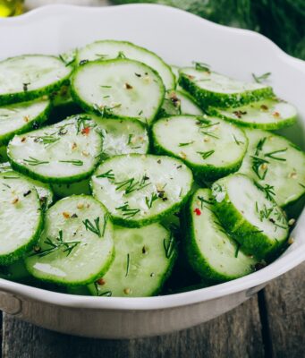 Cucumber Salad Cucumber salad. Fresh green cucumbers and dill salad bowl with olive oil