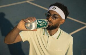 Captains’ Corner: Summer Tennis Essentials Tennis player on court drinking from a bottle of water.