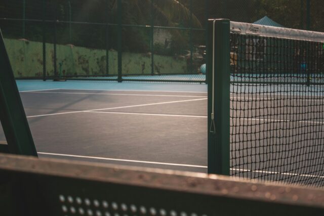 fei-chao-8YCl4td7PvM-unsplash Tennis court lit up at night