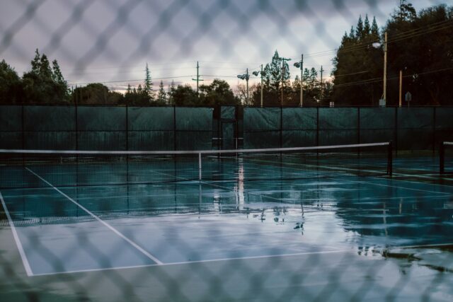 jesse-borovnica-VeCiMjp8hhc-unsplash rain-soaked tennis court