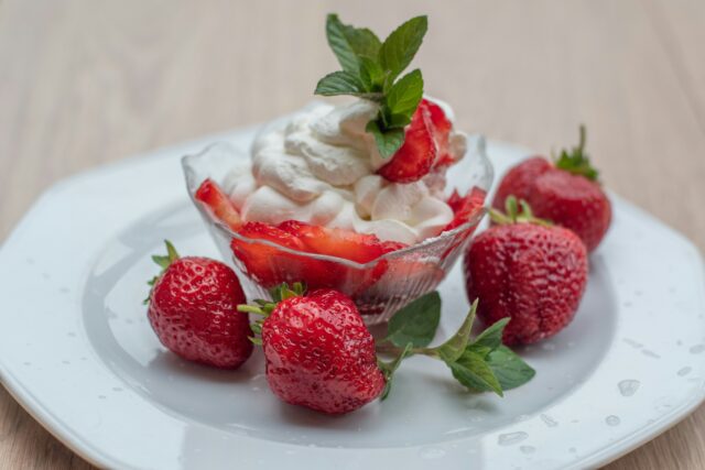 natalia-gusakova-uzjs9GRK32c-unsplash Bowl of strawberries and cream
