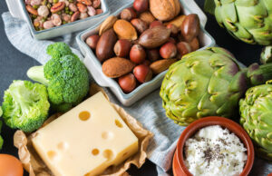 Protein Power For Racquet Sports Assortment of healthy protein source and body building food. Meat beef salmon chicken breast eggs dairy products cheese yogurt beans artichokes broccoli nuts oat meal. Top view flat lay