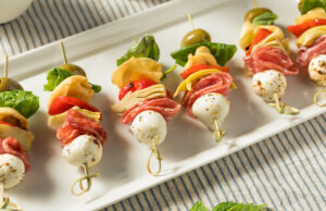 Antipasto Skewers Homemade Antipasto Bite Appetizer with Mozarella Salami Basil and Artichoke