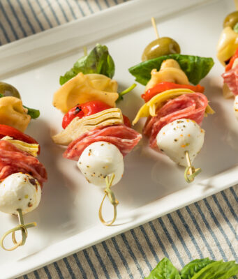 Antipasto Skewers Homemade Antipasto Bite Appetizer with Mozarella Salami Basil and Artichoke
