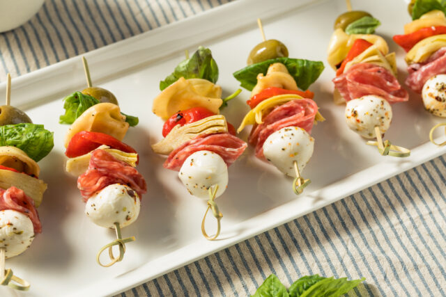 Homemade Antipasto Bite Appetizer with Mozarella Salami Basil and Artichoke